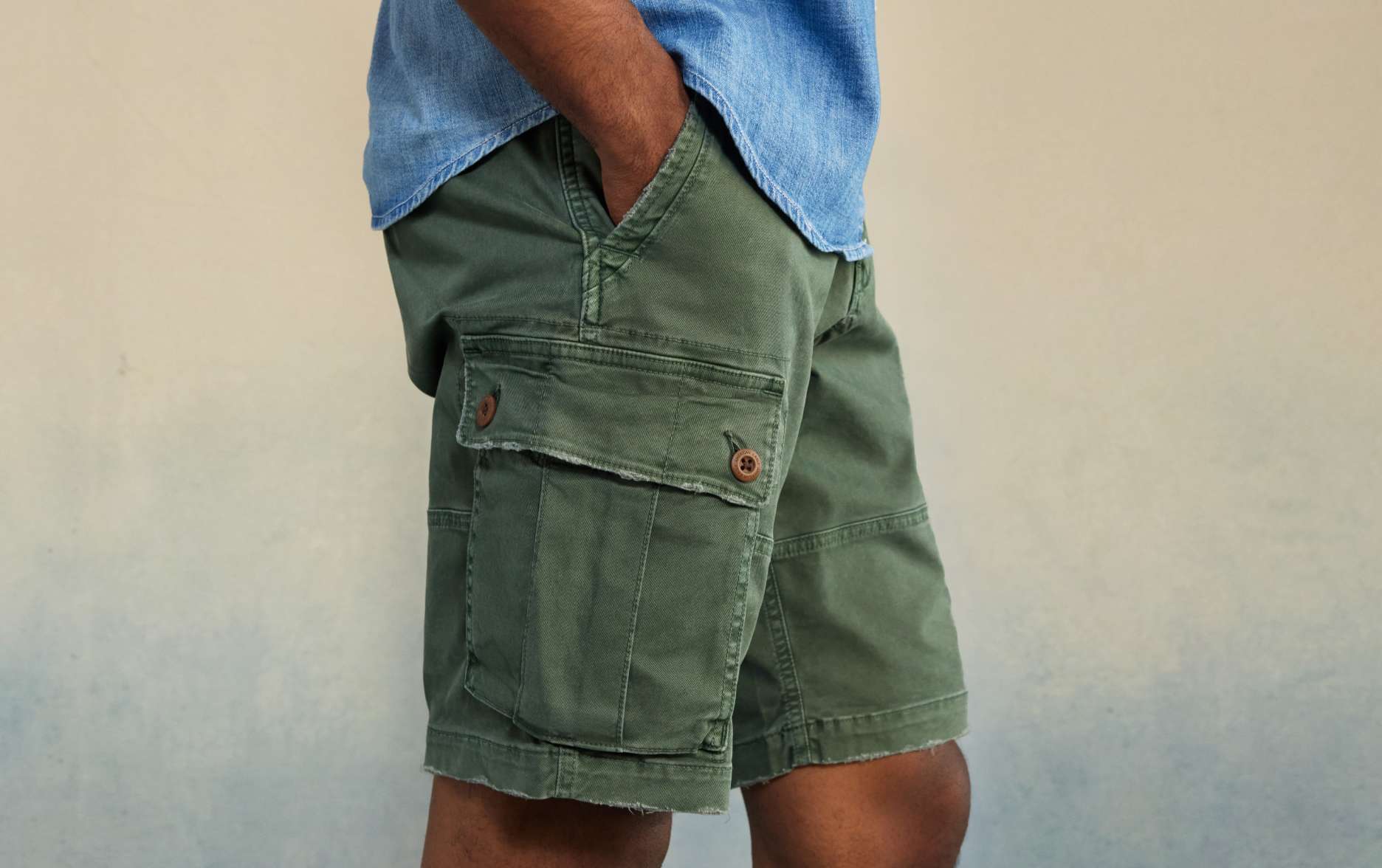 side cropped image of men's green cargos