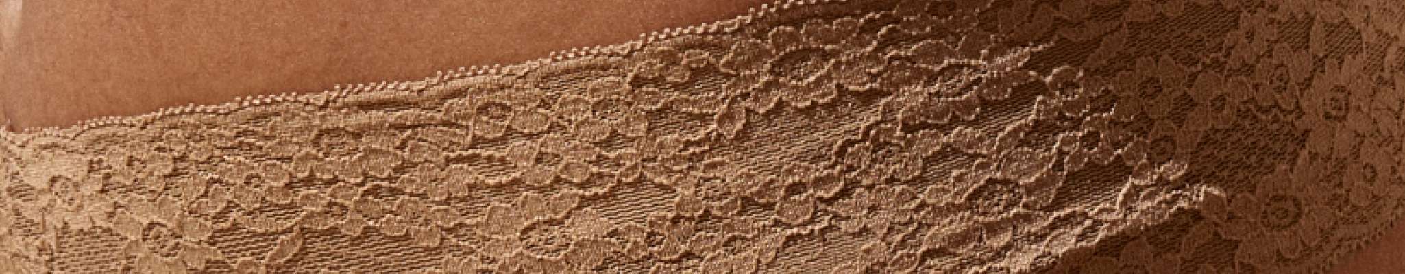 close up image of nude lace underwear fabric