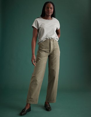 Premium Photo  A woman wears a white shirt with a white shirt and khaki cargo  pants.