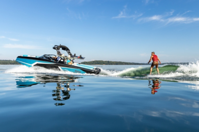 Wake surfer behind Heyday Wake Boat, Port-side View