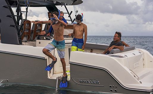 Kids jumping out of dive door with snorkle gear