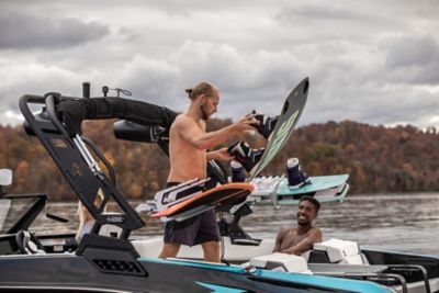 People getting ready to wakeboard on the Heyday H22