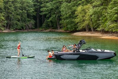 people lounging on the WTSurf wake boat from Heyday