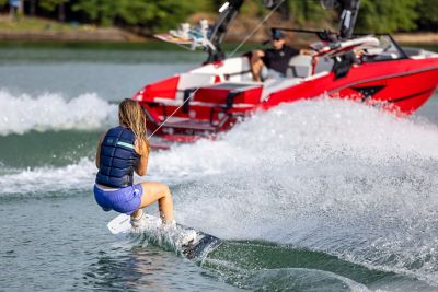  Wakeboarder behind a red H20 wake boat