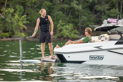 Man standing on the back of an H22 wake boat