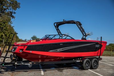 red and black Heyday WTSurf wake boat on a trailer