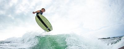 wake surfer above a wave