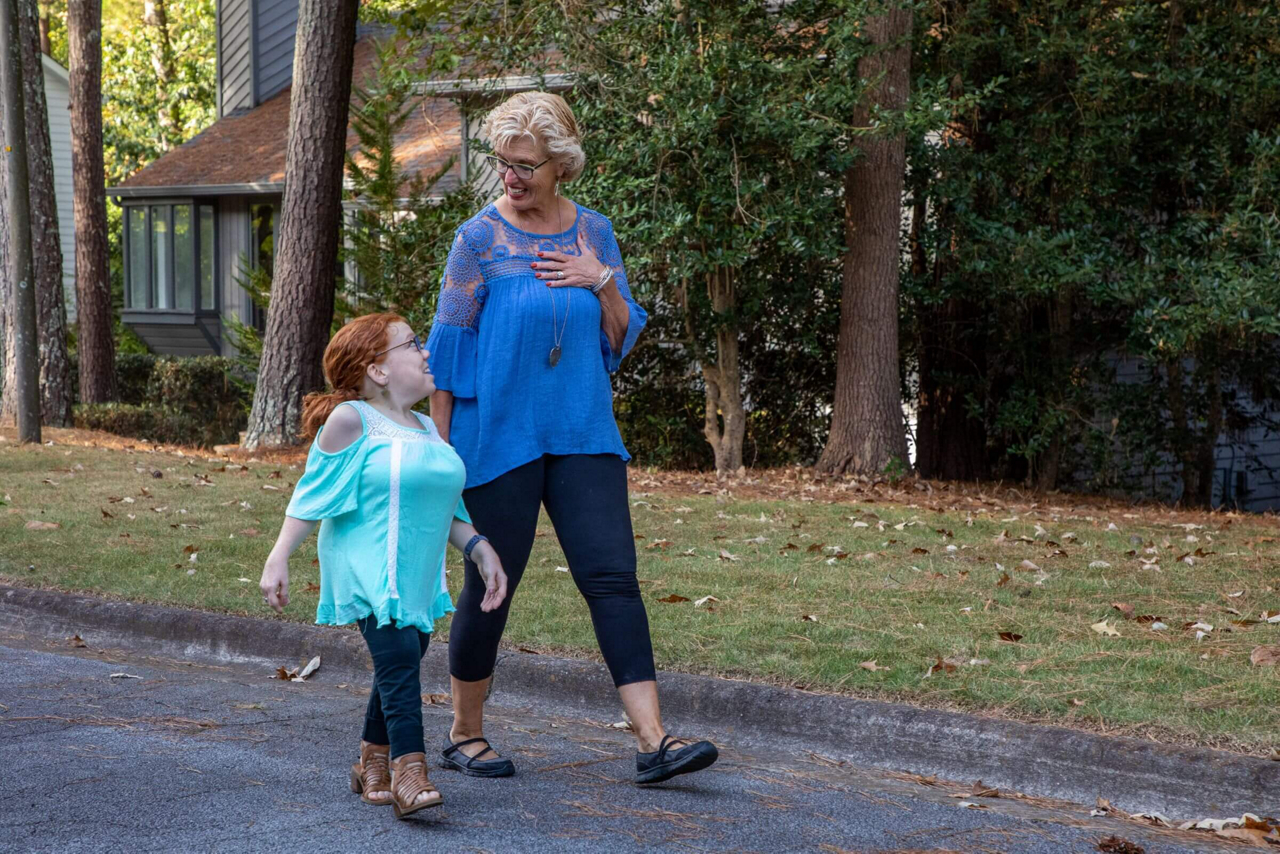 Friends talk and walk the neighborhood