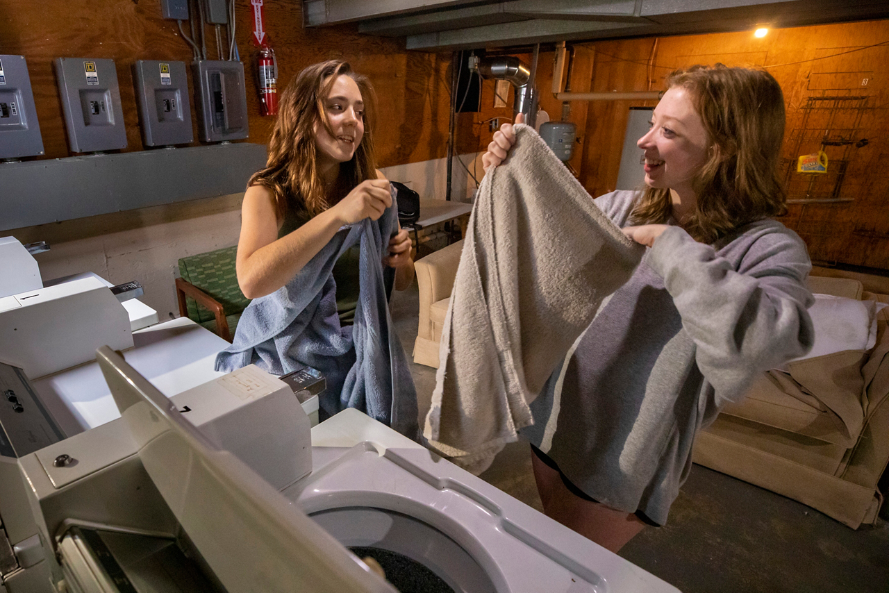 Gap year students from left 
Esther Cox
Dani Markham do laundry 