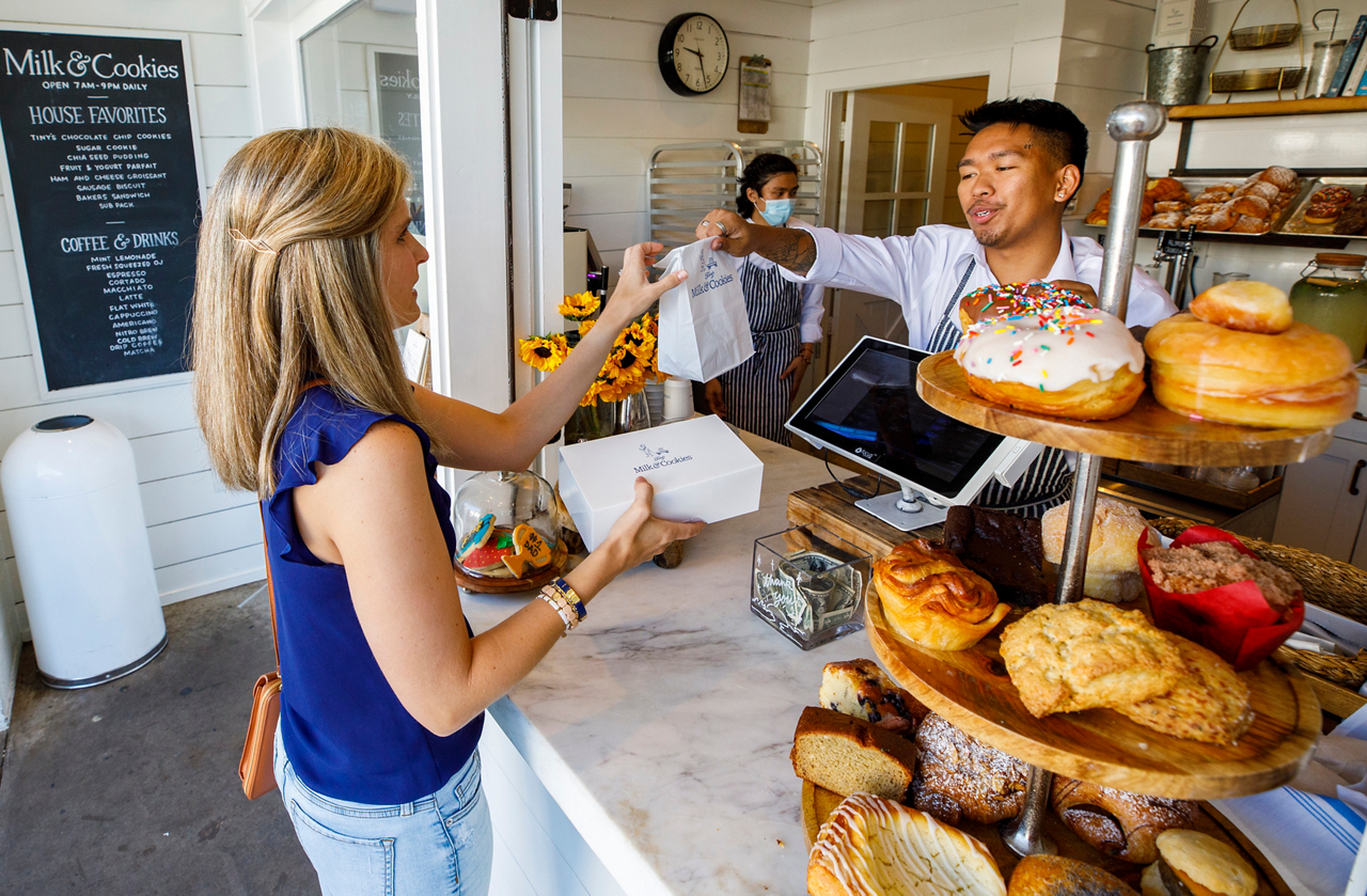 Jane Nodskov (story subject) purchases cookies for Houston Haven guests
