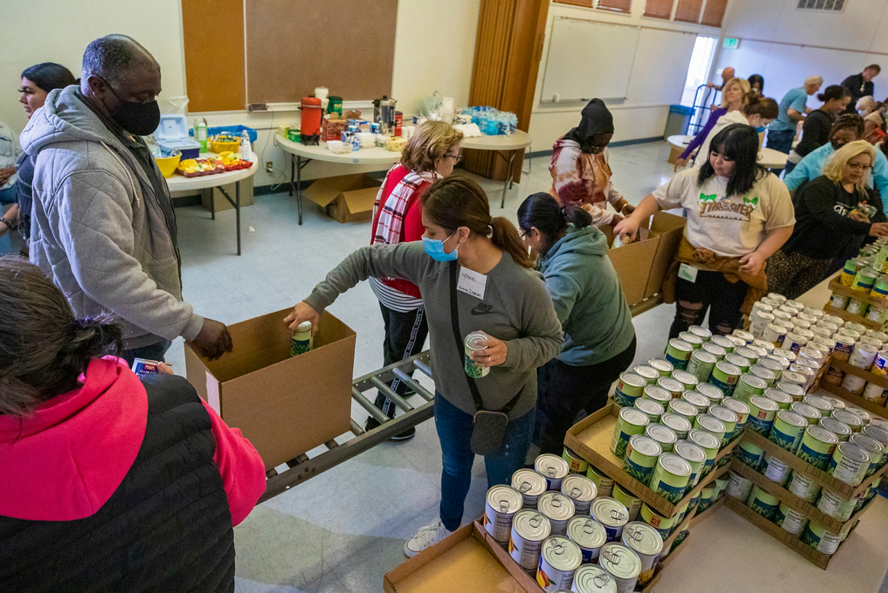 Volunteers from 25 Bakersfield churches use assembly-line rollers to pack several hundred Boxes of Love®.