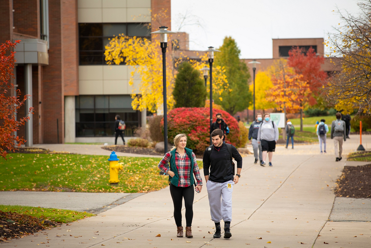 Rochester Institute of Technology, Maameyaa Asiamah, Cru student leader. Students walking on RIT campus. 