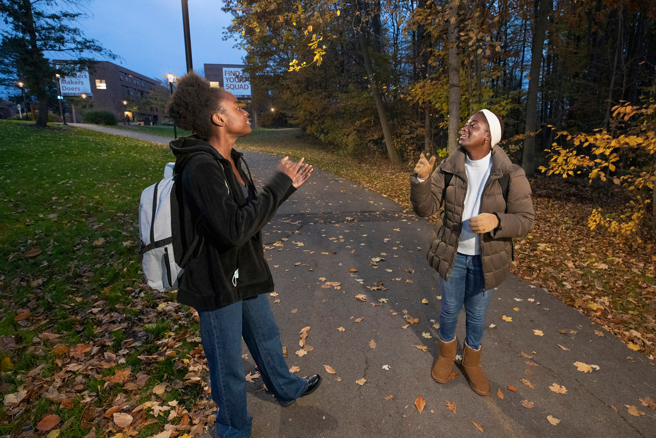 Rochester Institute of Technology, Maameyaa Asiamah, Cru student leader. She is talking to her friend Omowunmi Ayangbayi, while walking on campus. 