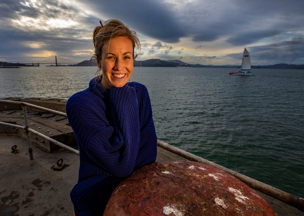 Hope poses on the Presidio pier with Golden Gate Bridge 