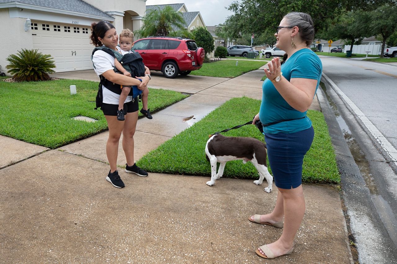 Talking with Aura Cater. She is a nurse. Getting some air after the rain. 