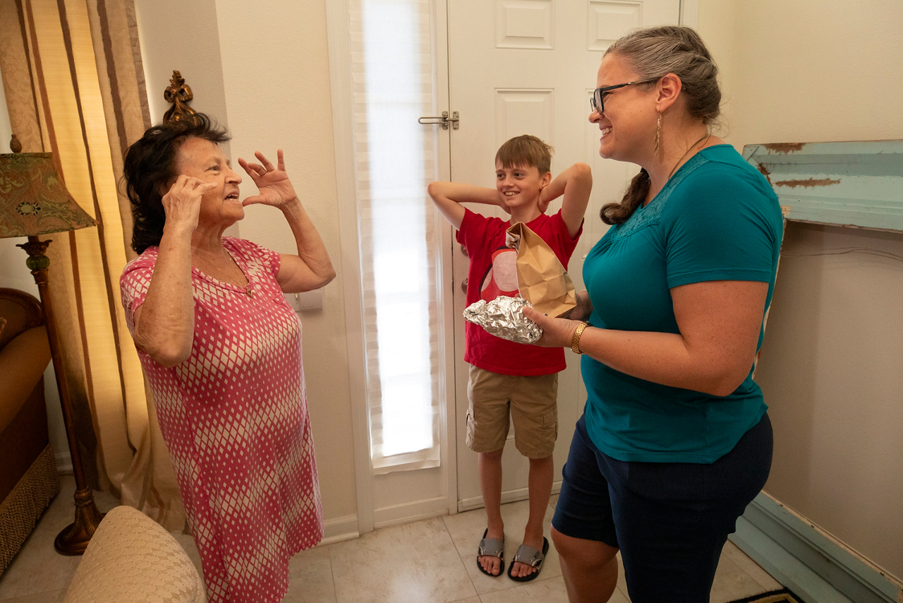 Talking with Elena Esposito, who gave Melody a big piece of cake. 