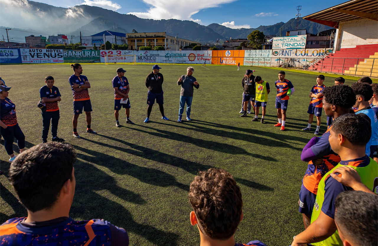 Cristobal, center, shares a biblical sports performance principle with the San Pedro team during practice.