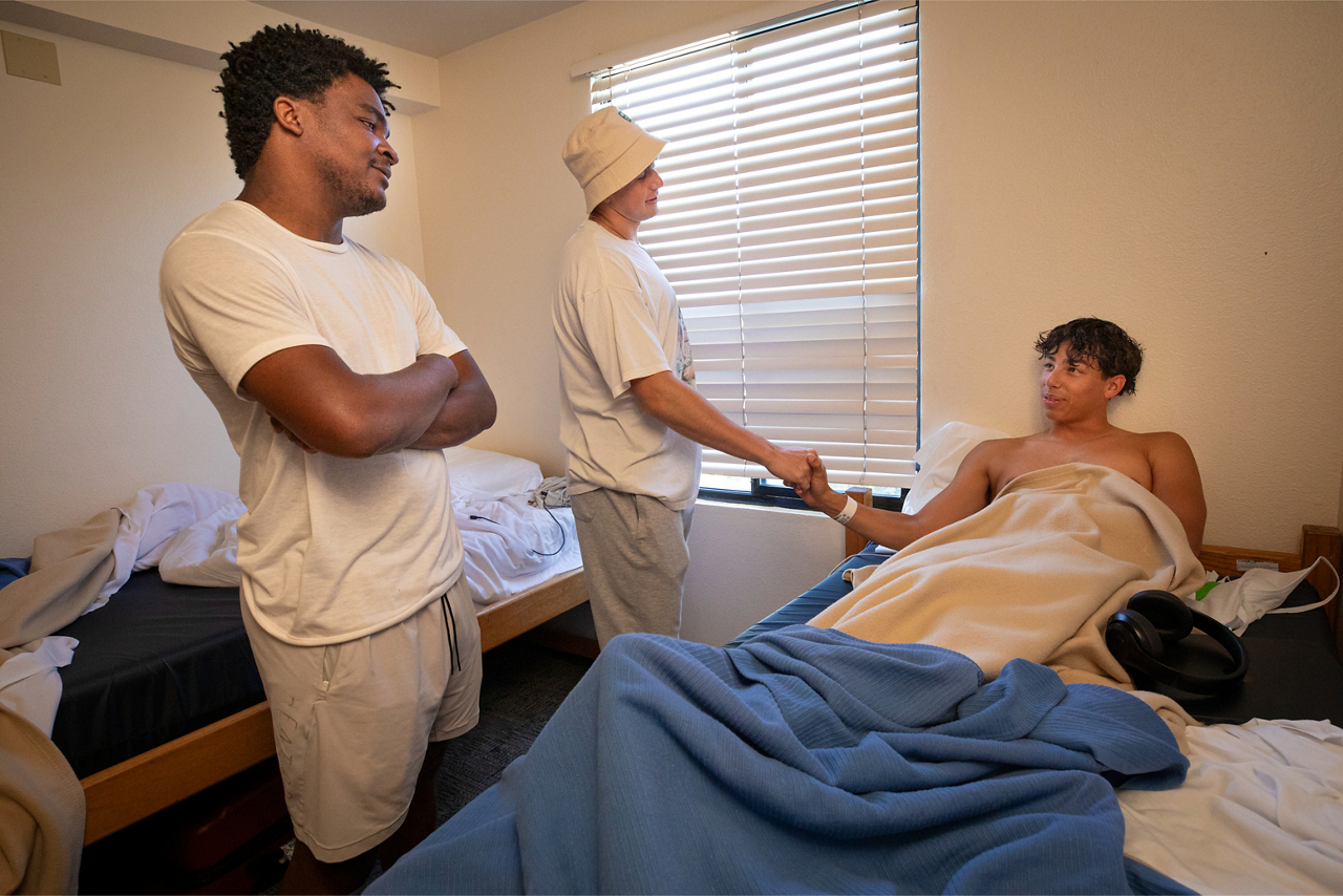 Logan (center) and Tater checked in on Ryan after he returned from the hospital. 