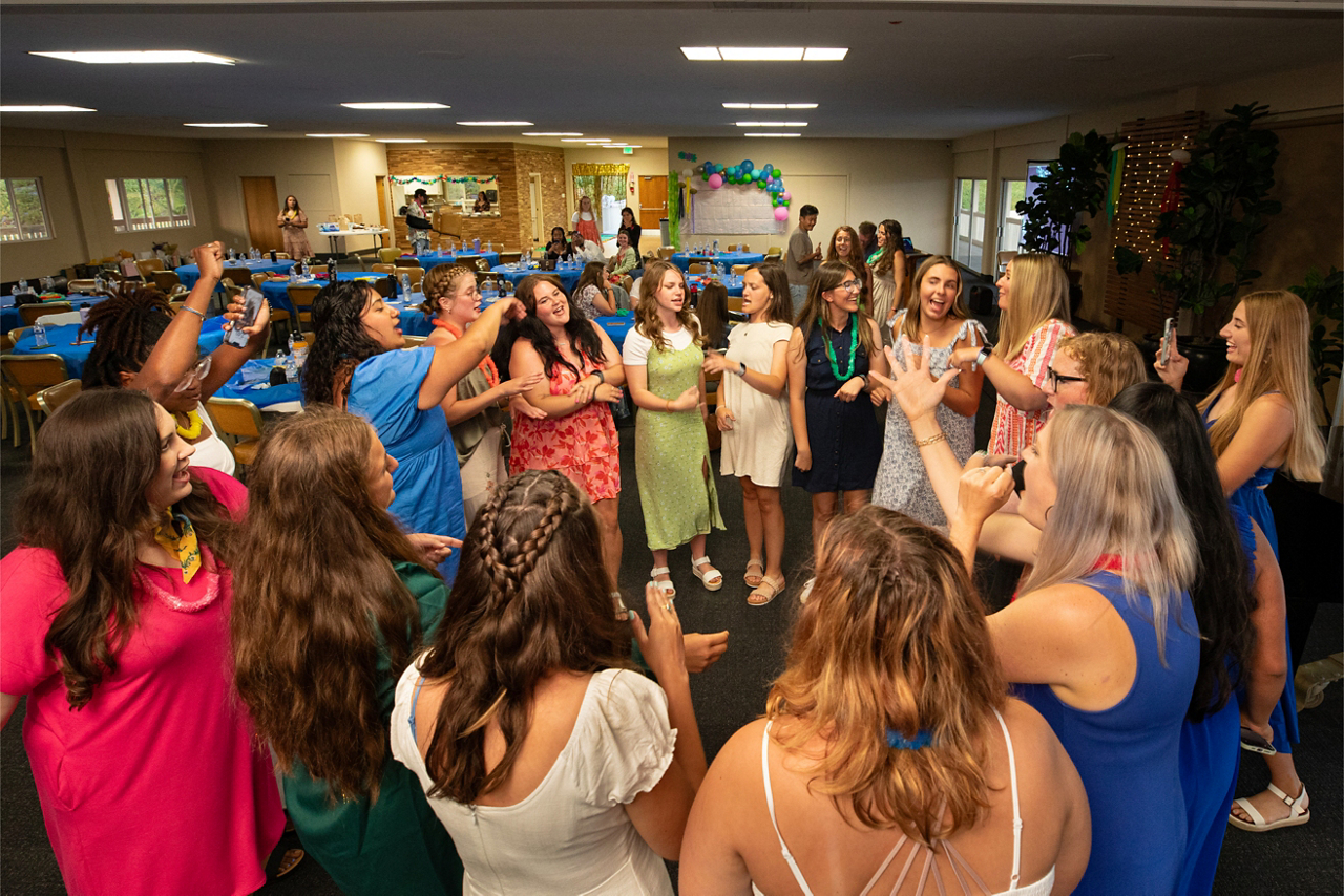 a circle of women celebrating