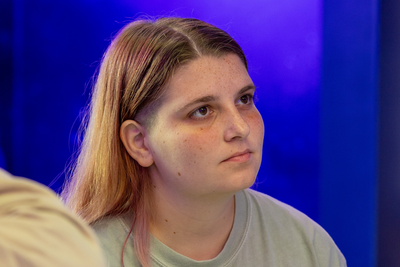 Rose listens intently
