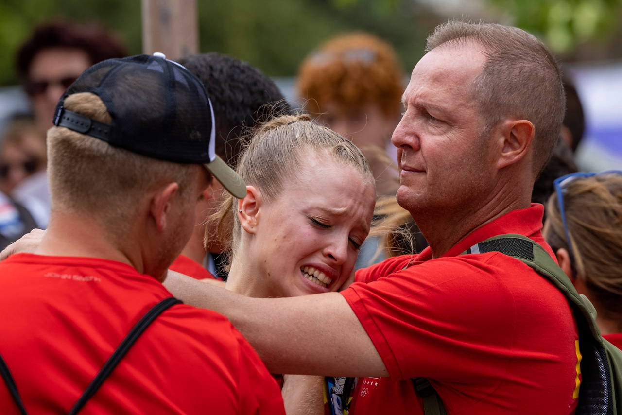 Olympic athlete consoled after losing