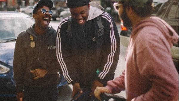 students laughing and talking in the city.