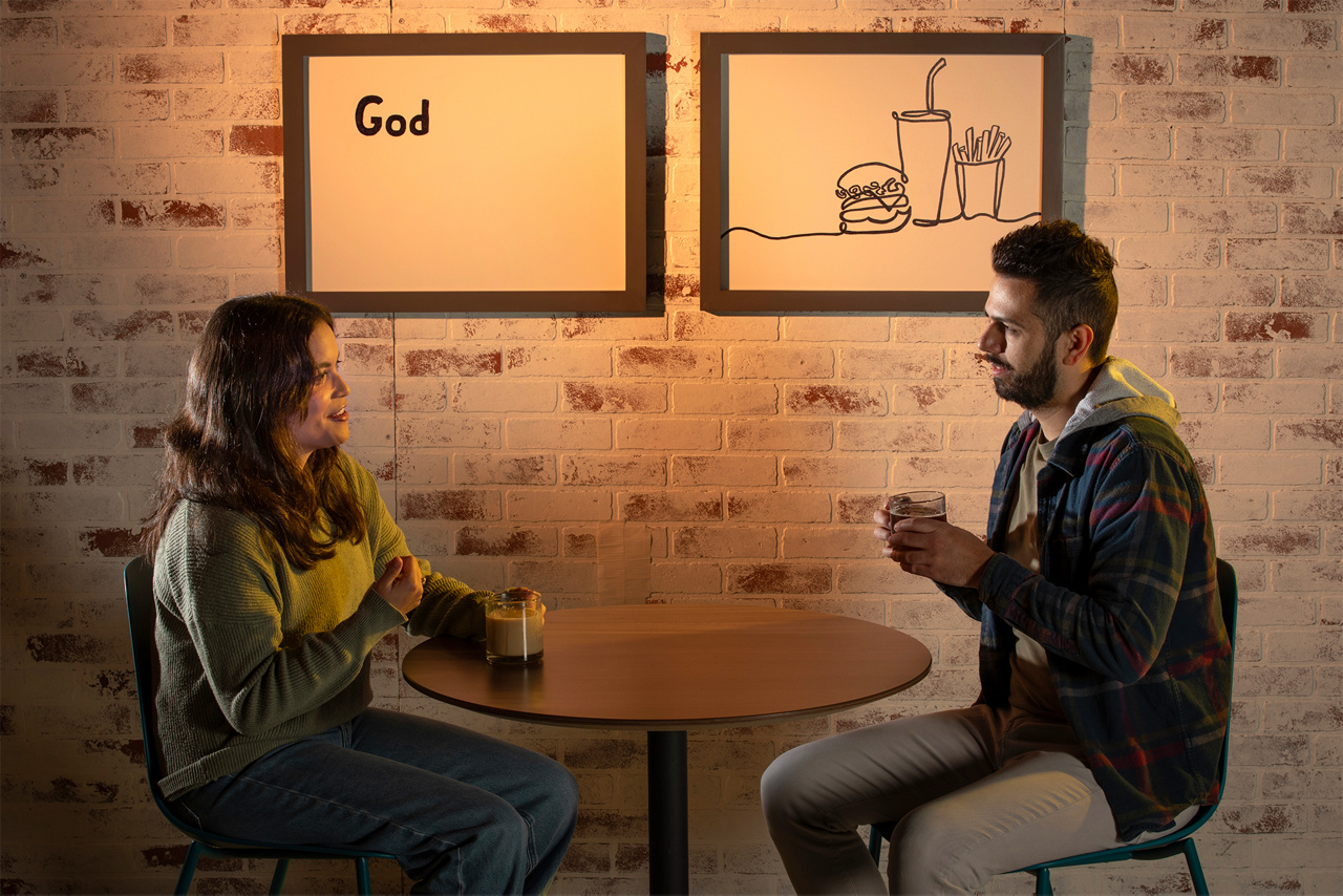 People sitting at coffee shop with signs representing thoughts in the background.