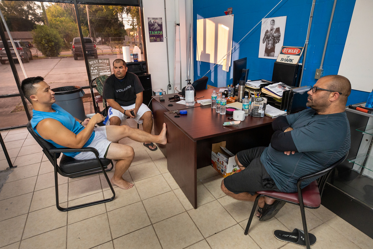 men talking in office