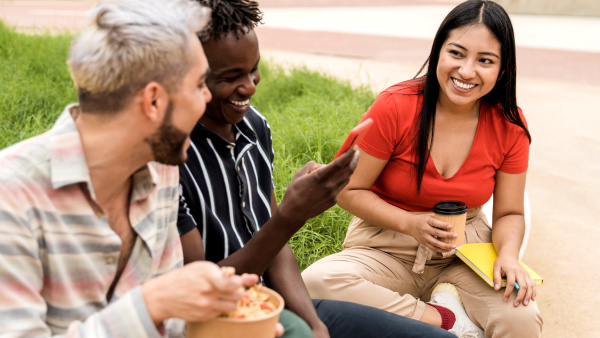 People eating lunch and laughing together.