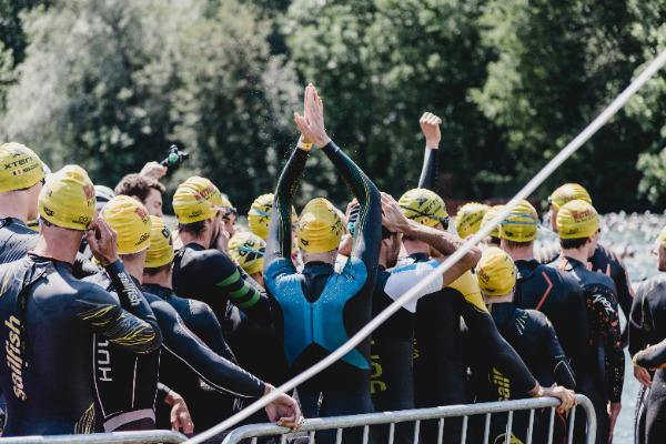 People lining up ready to swim for a race.