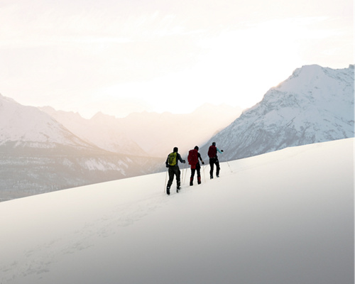 Silhoutte of people walking on mountain