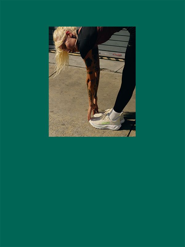 A woman wearing Hoka Arahi 9 running shoes