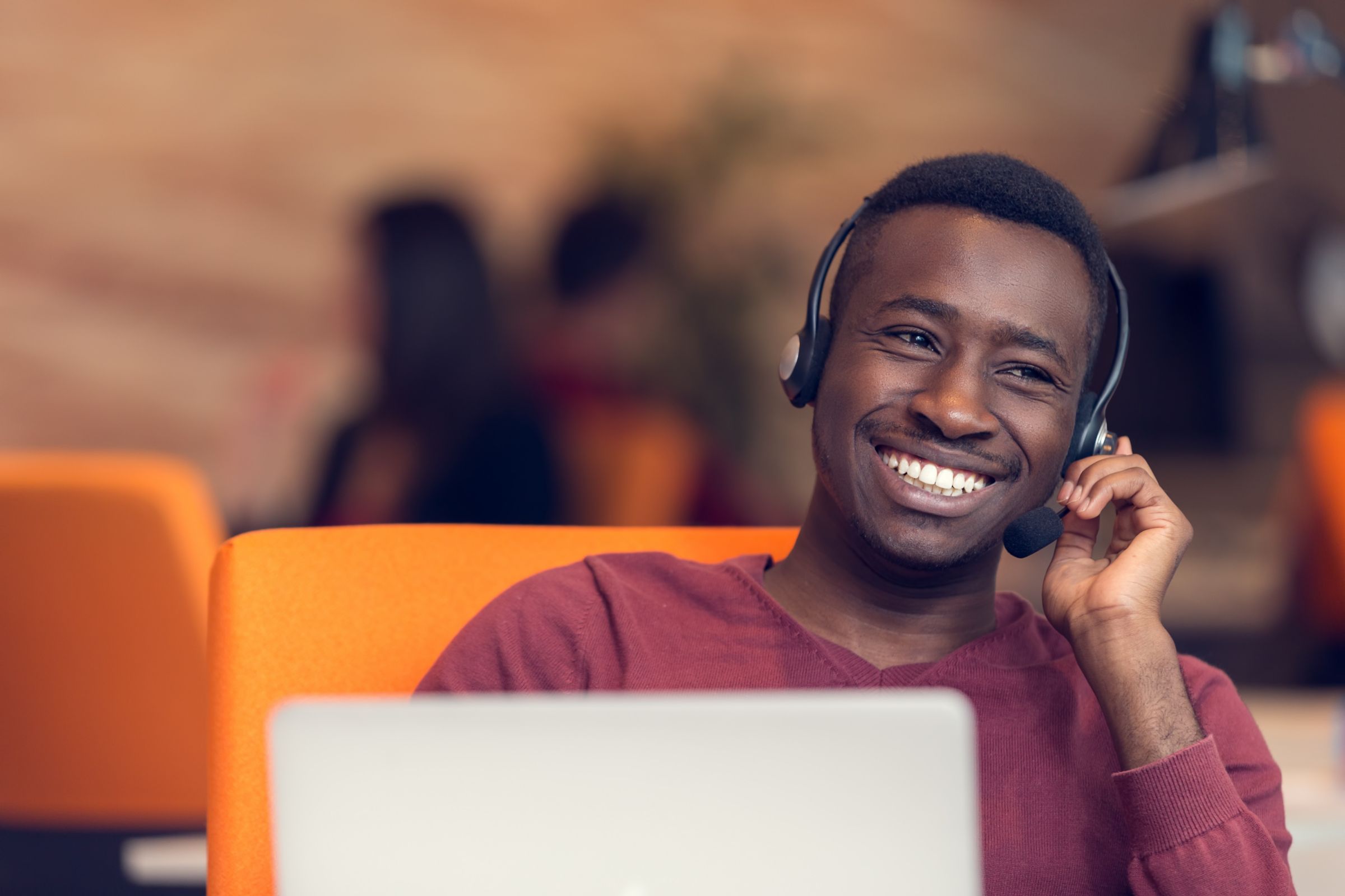 a man wearing a headset and smiling