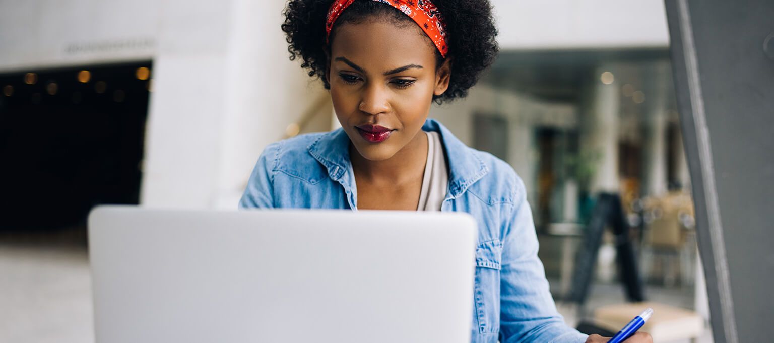 Woman looking at laptop