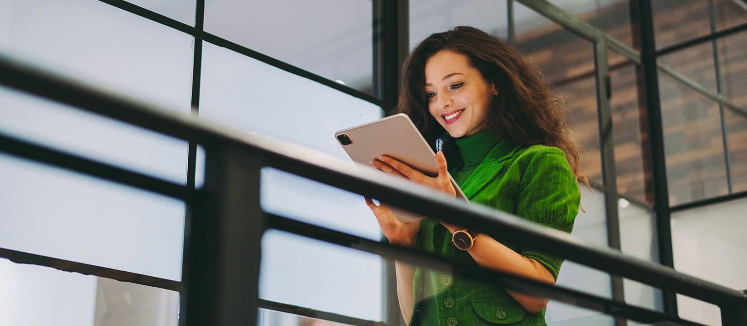 Woman working on tablet device