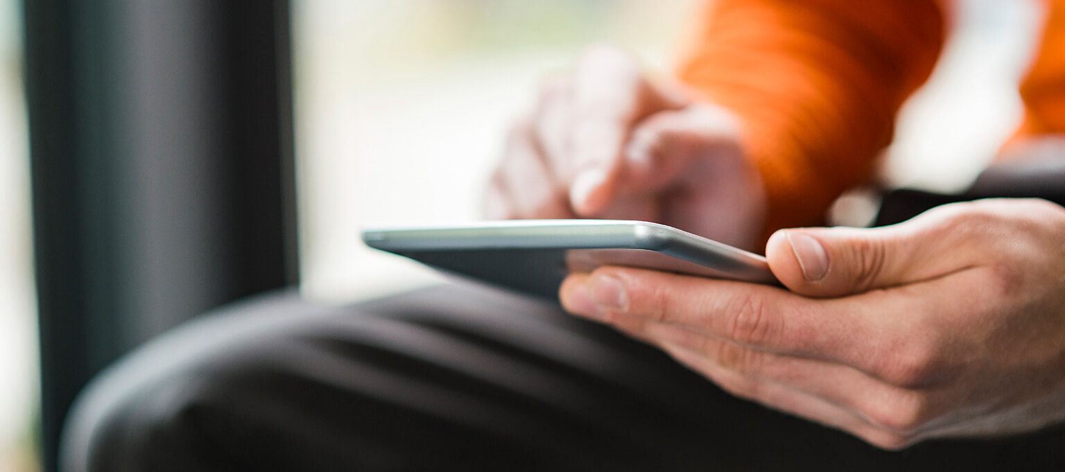 Man using tablet device