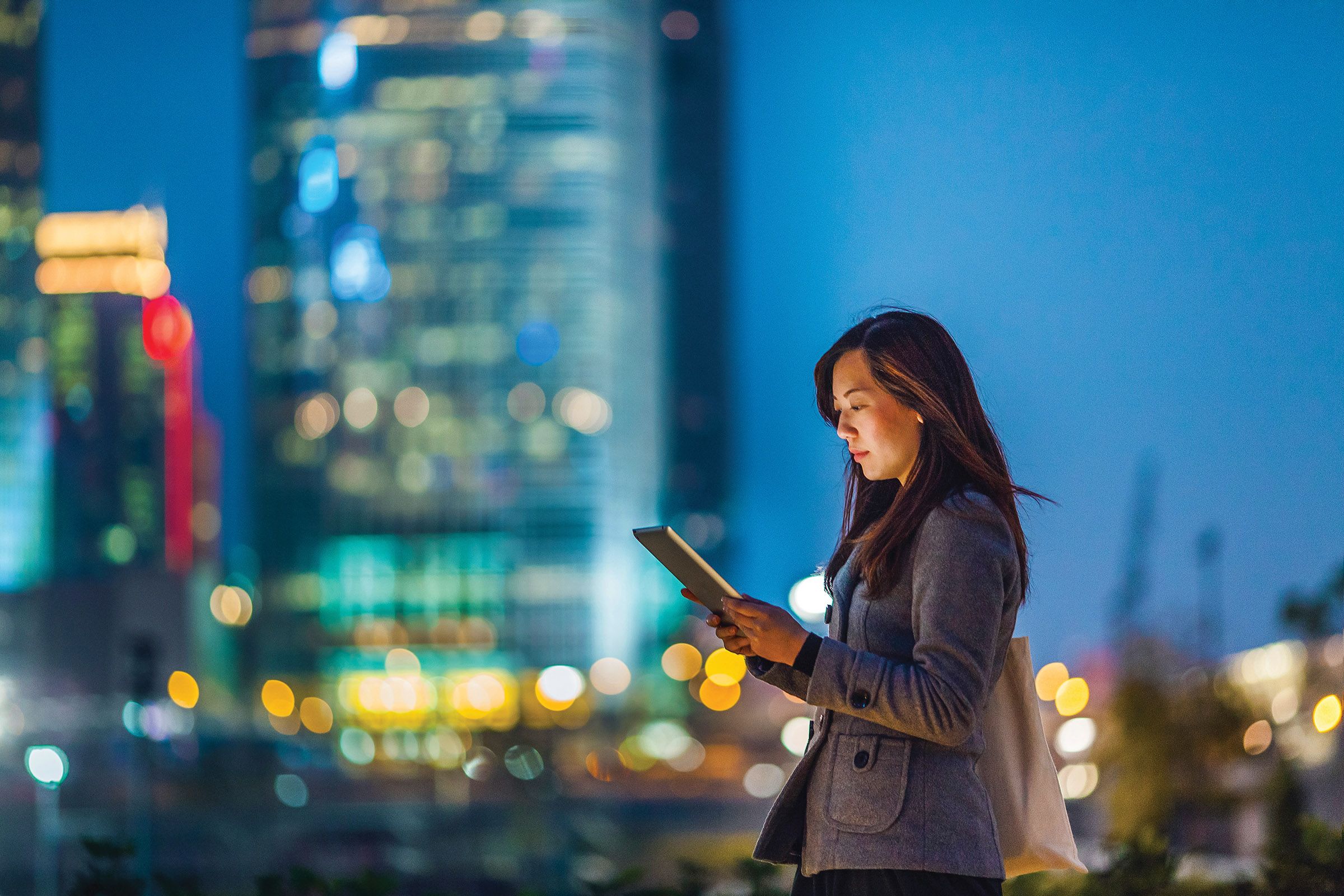 a woman looking at a tablet