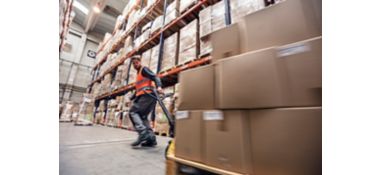 a man in a warehouse with boxes