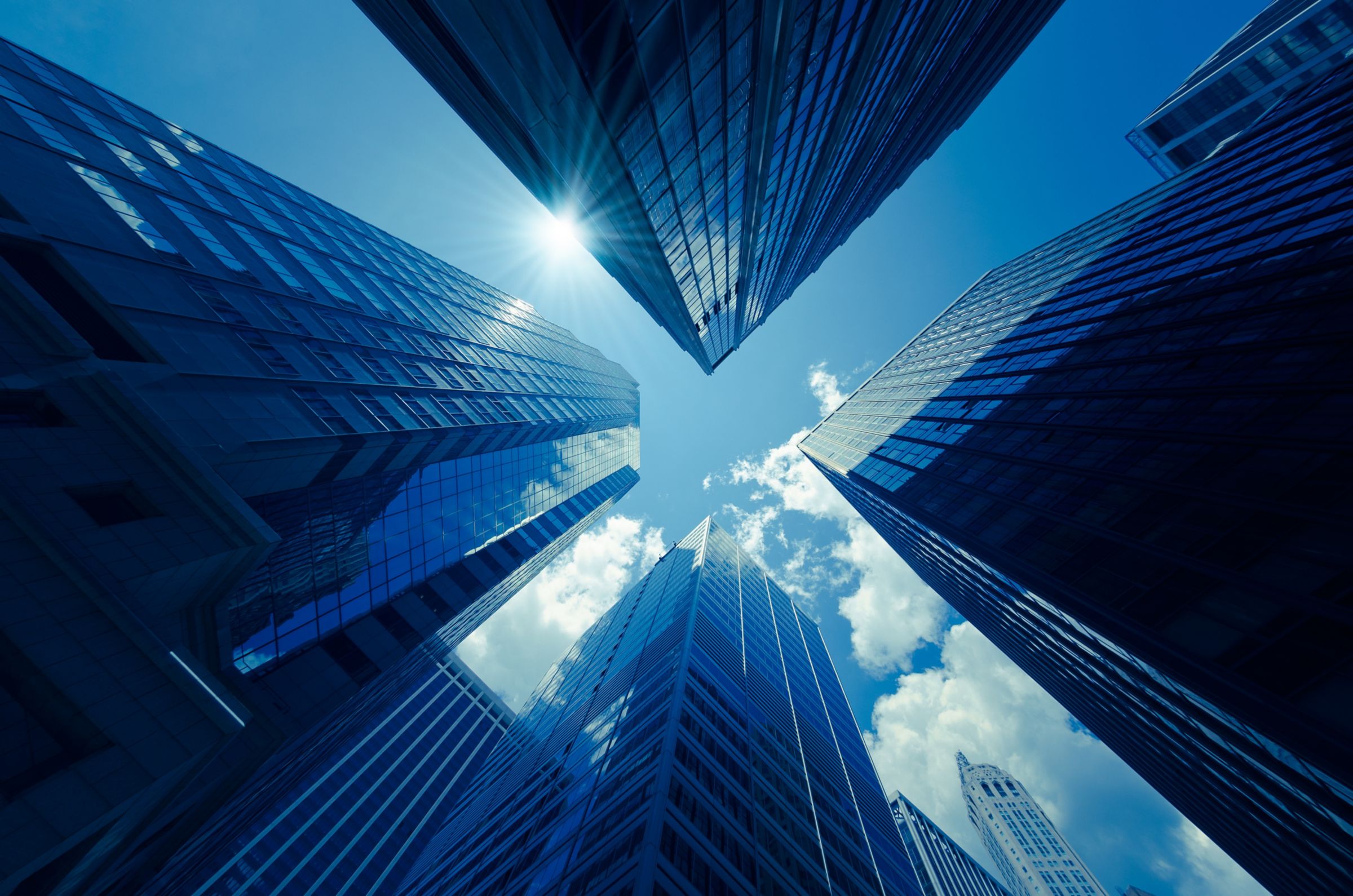 looking up view of a tall glass building