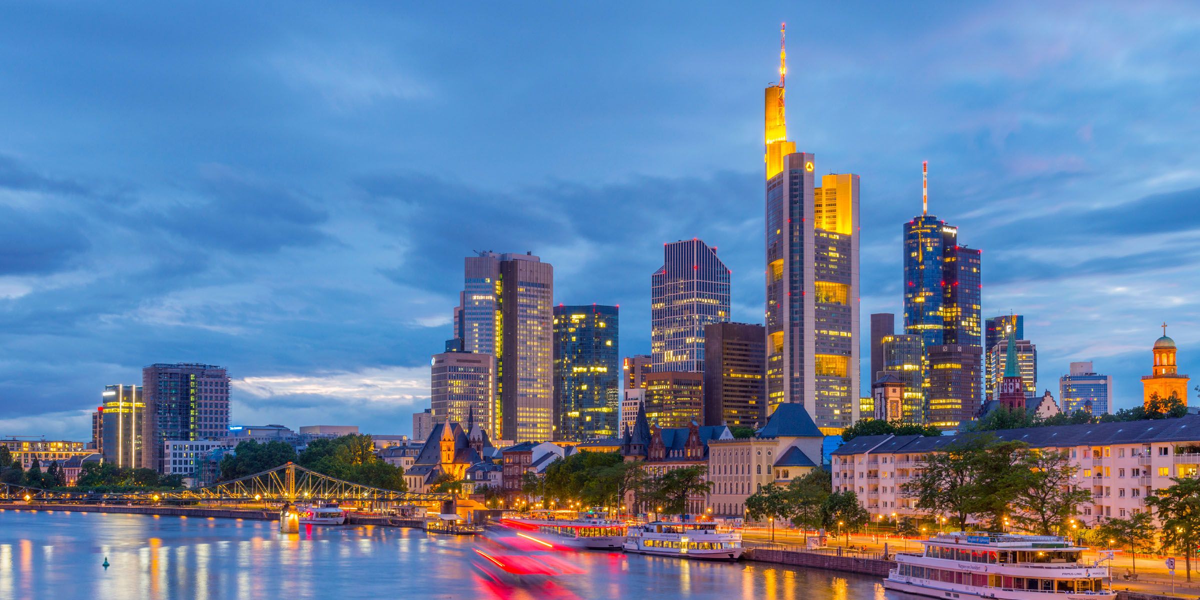 a deutschland city skyline with lights and a body of water