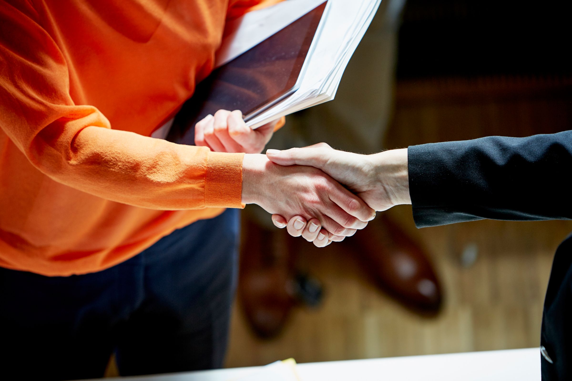 close-up of two persons shaking hands