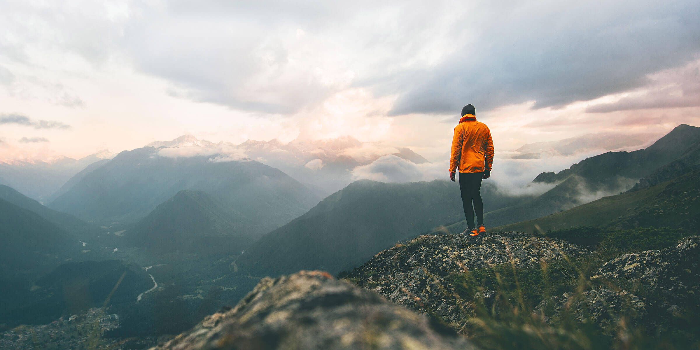 Man standing on top of mountain