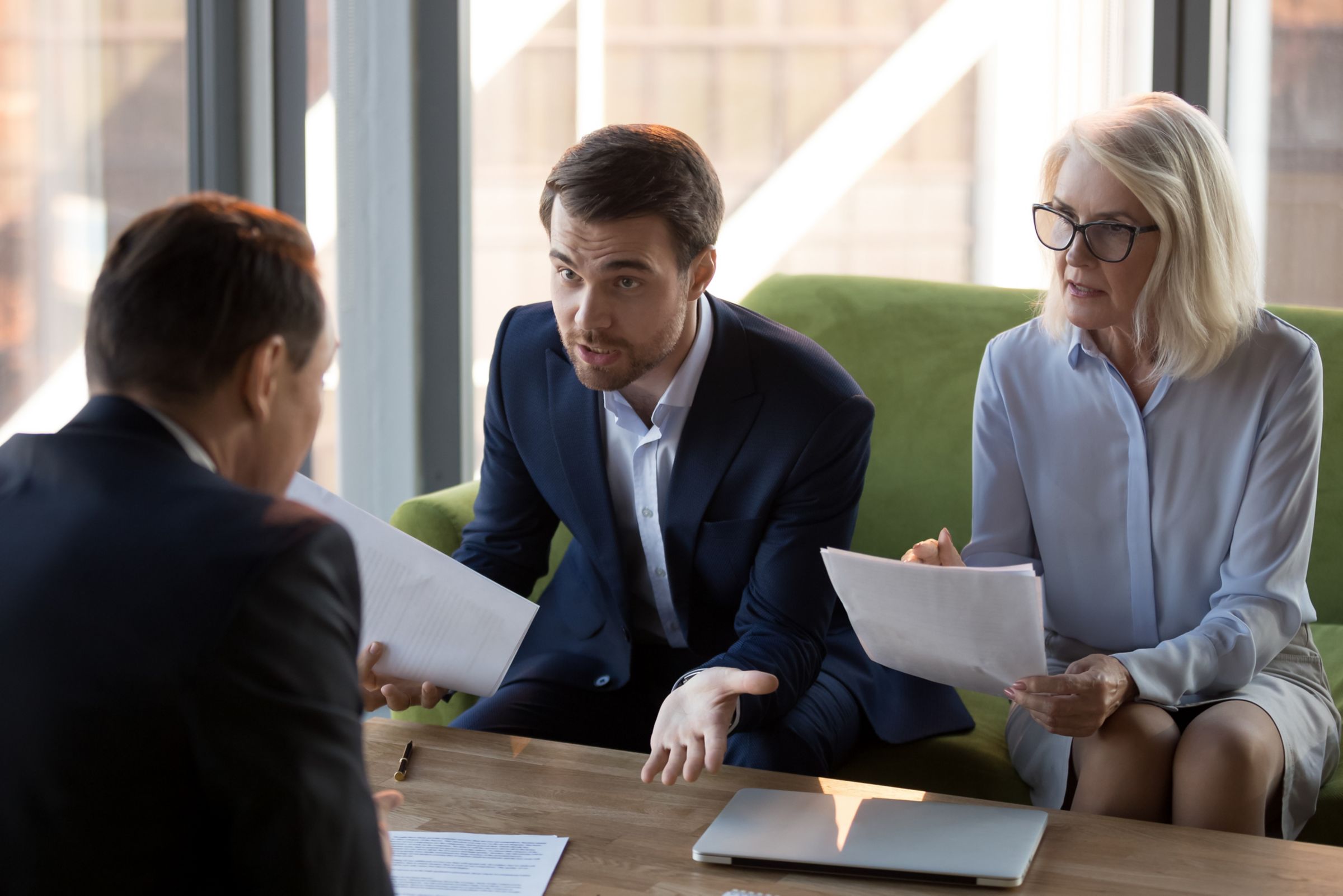 Concerned business people argue with colleague or client for dissatisfied with contract terms or agreement.