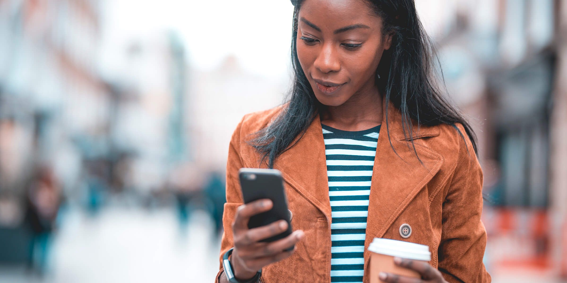 Woman banking by mobile device