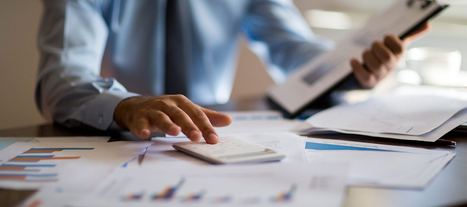 Businessman reading financial reports