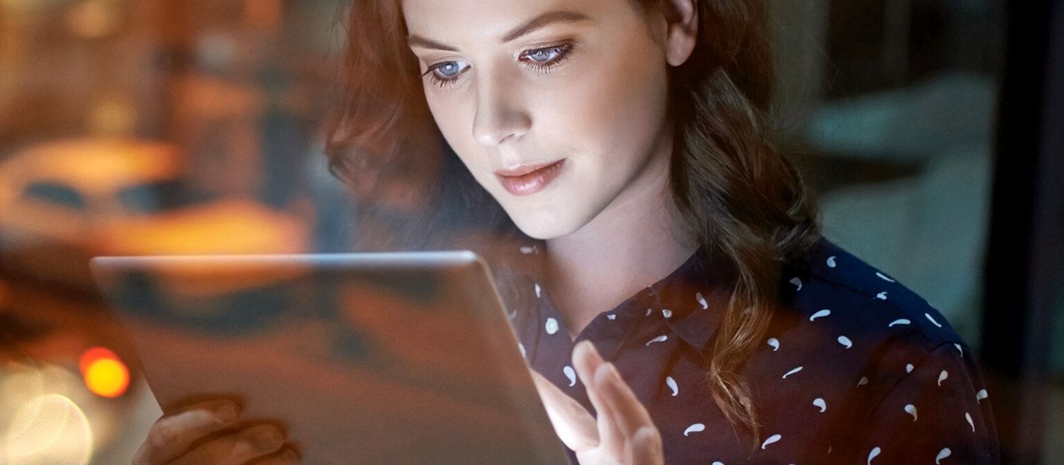 Woman working on tablet device