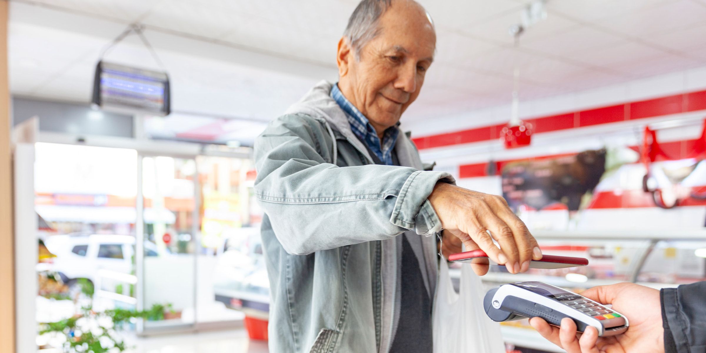 Person at a store paying with a digital wallet.