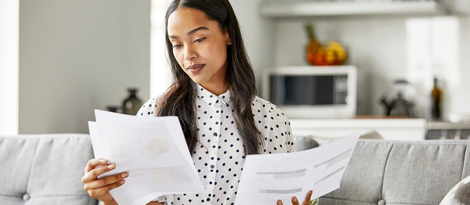 Black woman reading financial statements