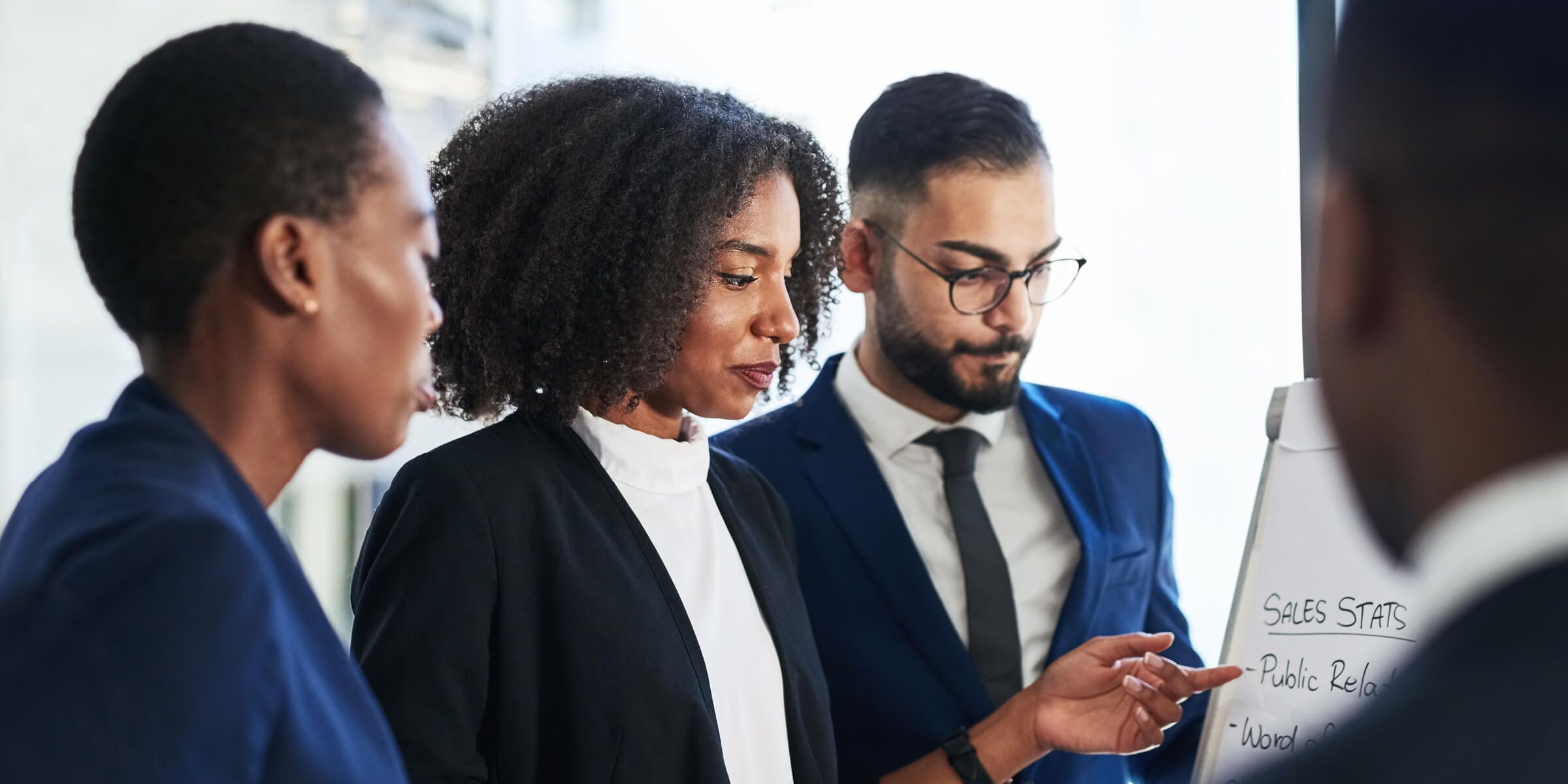 Diverse executives reviewing a document together