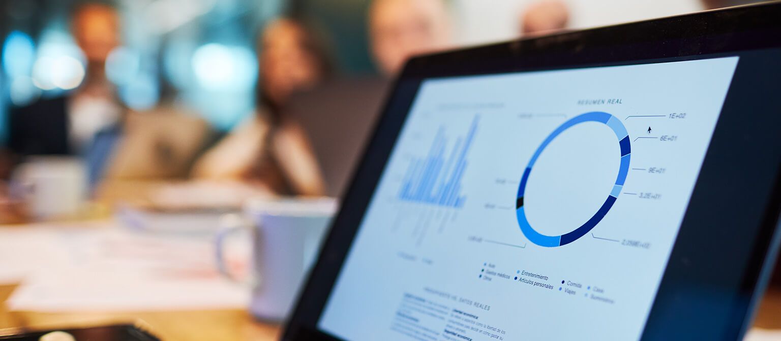 Close up image of laptop computer displaying financial graph